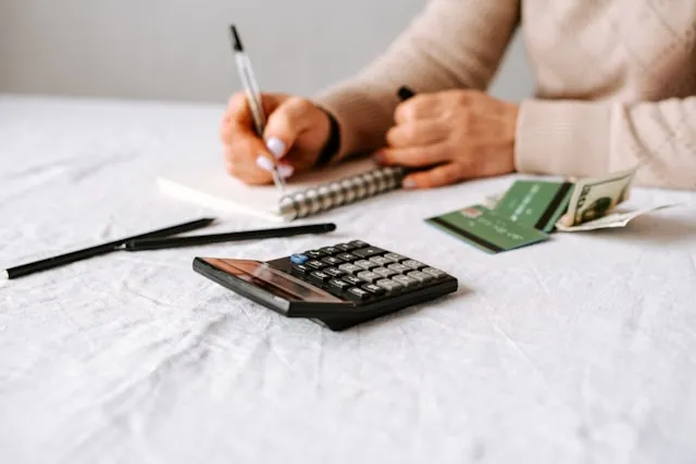 Person reviewing an annuity contract and financial documents