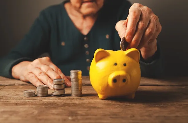 Person reviewing an annuity payment schedule and contract documents
