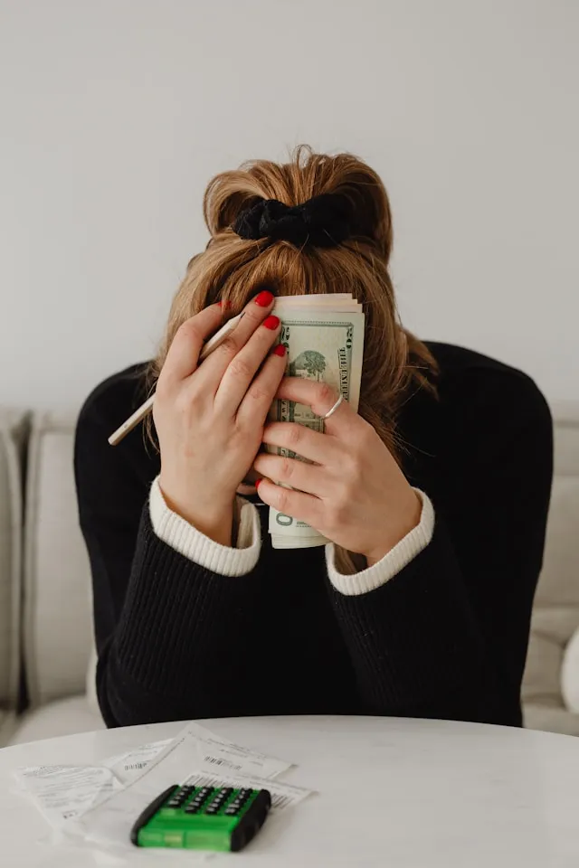 Person building a debt-free household budget after paying off balances