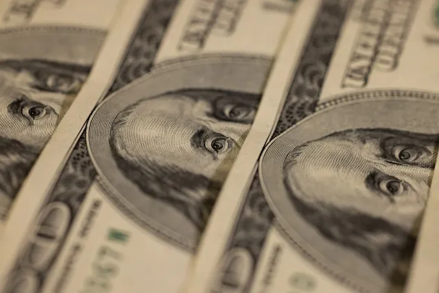Coins and rising cost chart representing inflation's impact on settlement payments