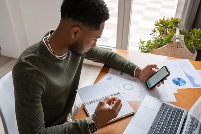 Person reviewing prior transfer agreements and settlement documents