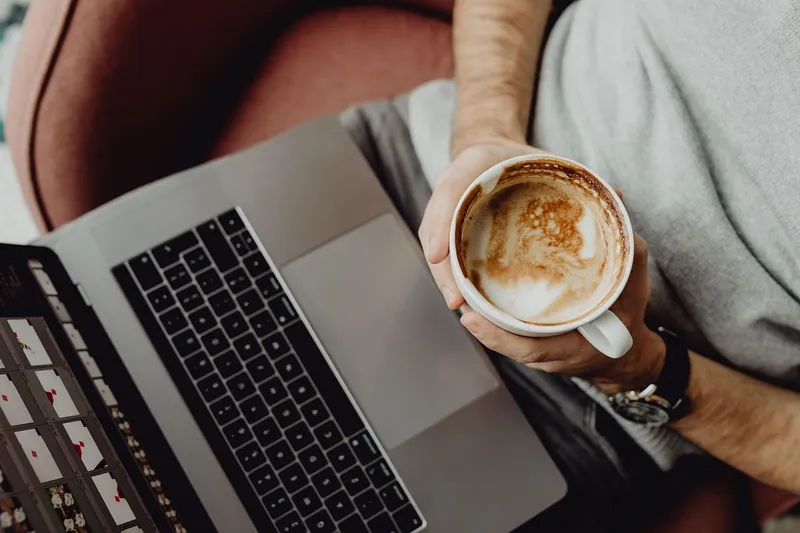 Senior man using laptop at home