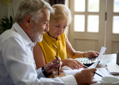 Older couple reviewing annuity documents together
